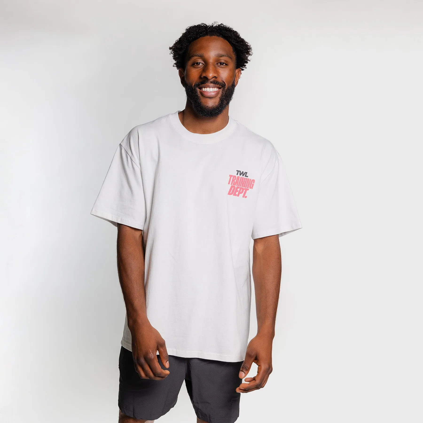TWL - LIFESTYLE OVERSIZED T-SHIRT - TRAINING DEPARTMENT - FADED WHITE/NEON PINK