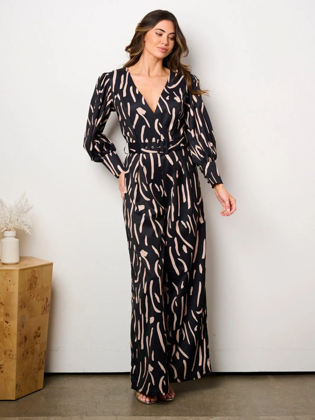 WOMEN'S LONG SLEEVE SURPLICE BELTED PRINT JUMPSUIT
