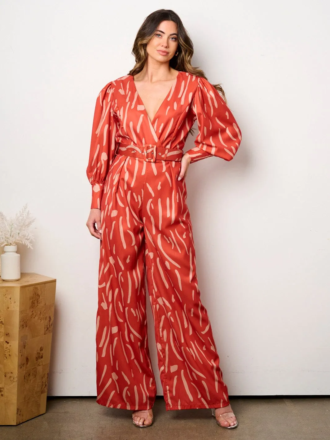 WOMEN'S LONG SLEEVE SURPLICE BELTED PRINT JUMPSUIT